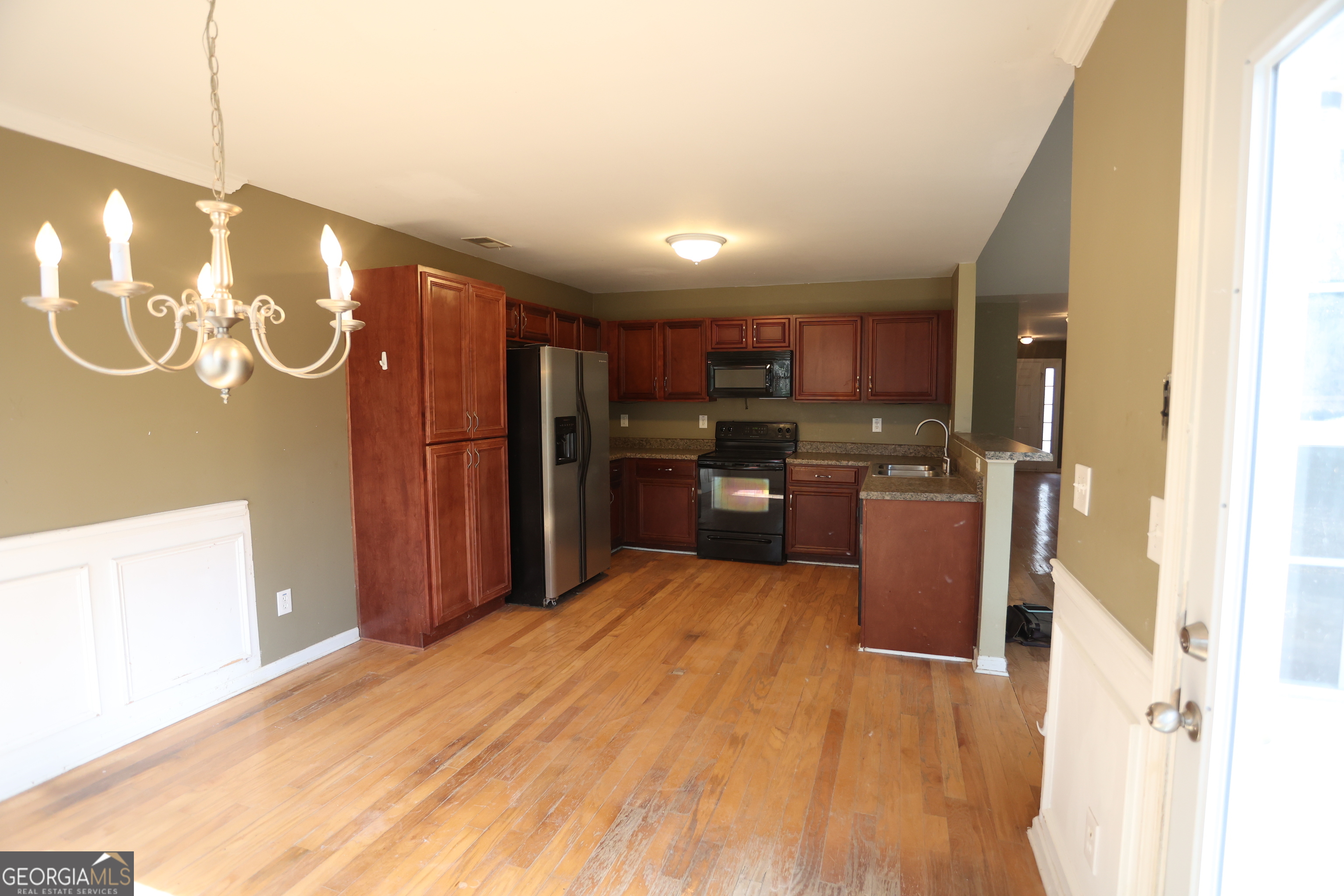 61 Concord Street North Concord, GA 30206 - Photo 21 of 37 a kitchen with stainless steel appliances kitchen island granite countertop a refrigerator and a stove top oven