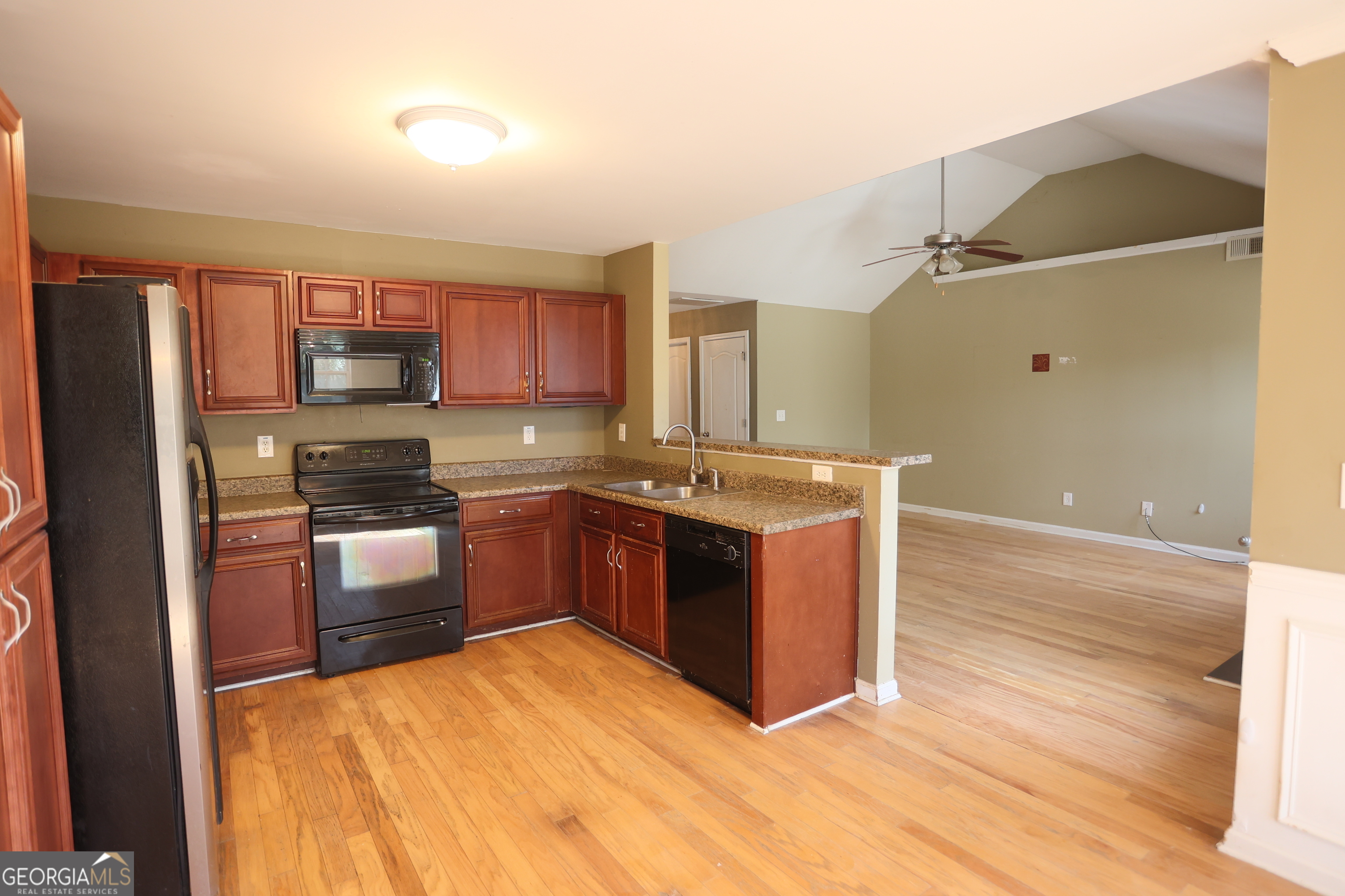 61 Concord Street North Concord, GA 30206 - Photo 23 of 37 a kitchen with stainless steel appliances granite countertop a stove a sink and a refrigerator