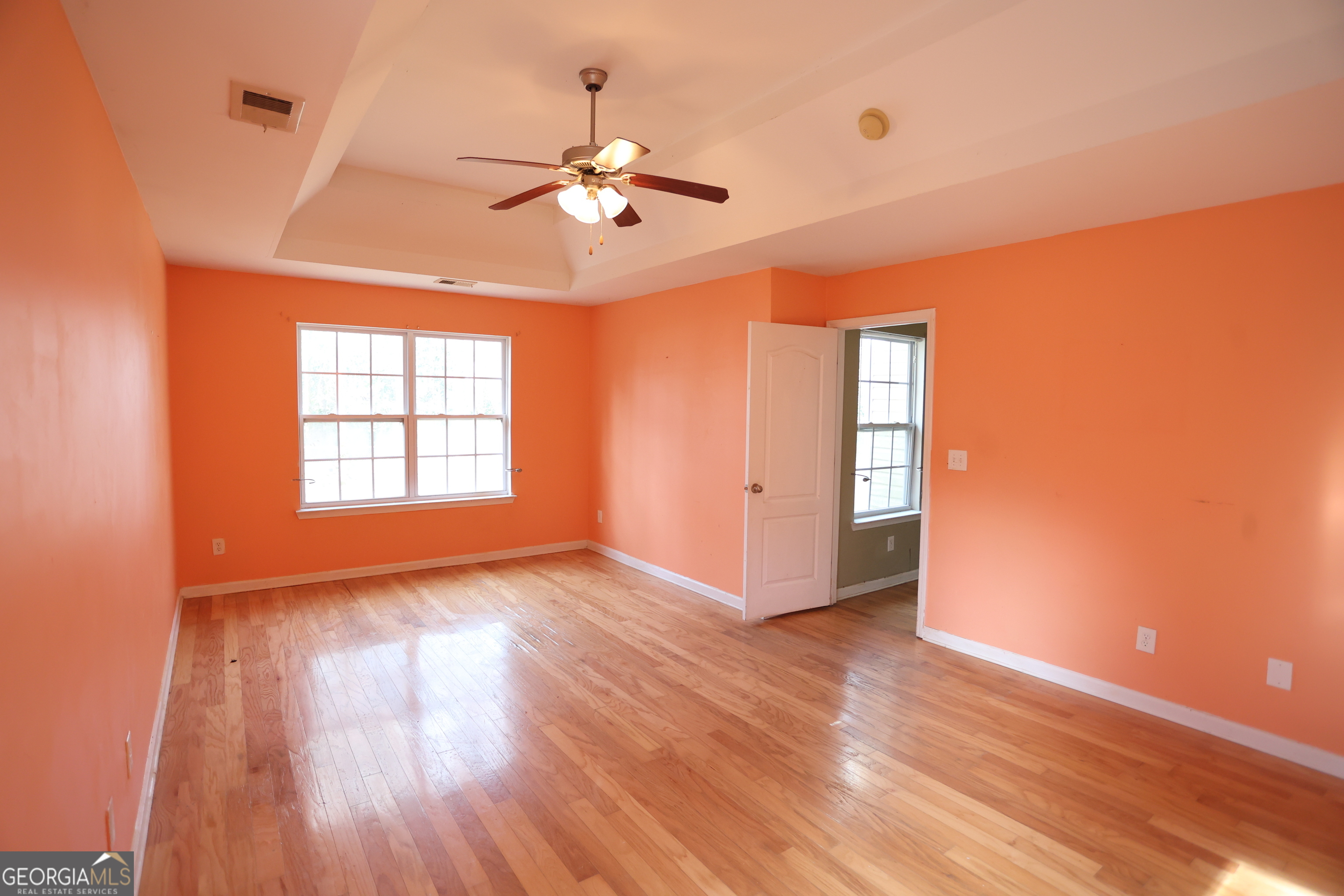 61 Concord Street North Concord, GA 30206 - Photo 27 of 37 a view of an empty room with wooden floor and a window