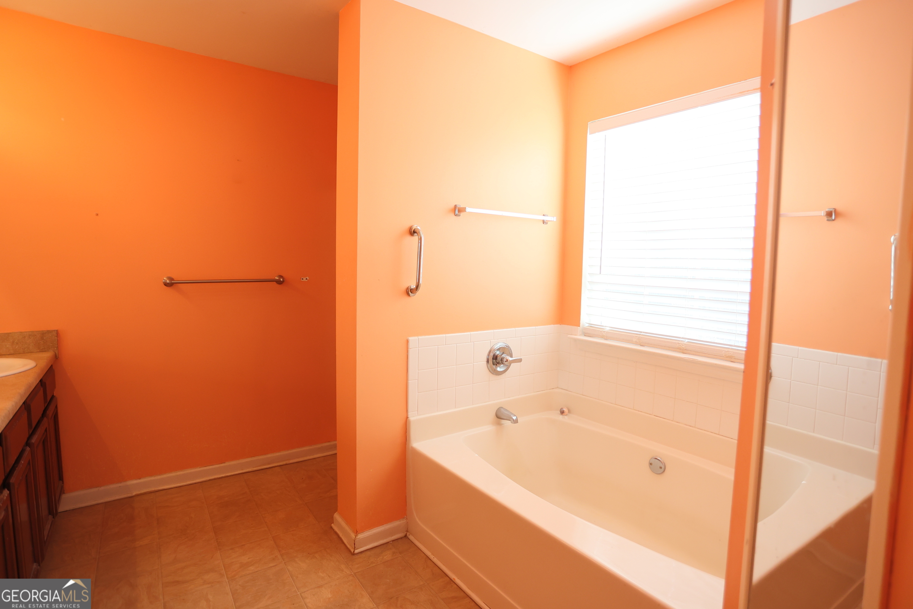 61 Concord Street North Concord, GA 30206 - Photo 30 of 37 a bathroom with a bathtub and a shower