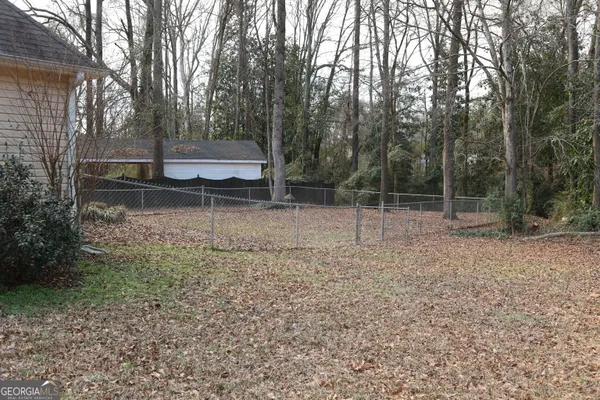 a backyard of a house with lots of green space