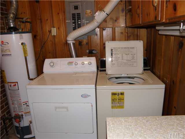 5121 Wickham Road Raleigh, NC 27606 - Photo 11 of 21 a view of storage and utility room with washer and dryer