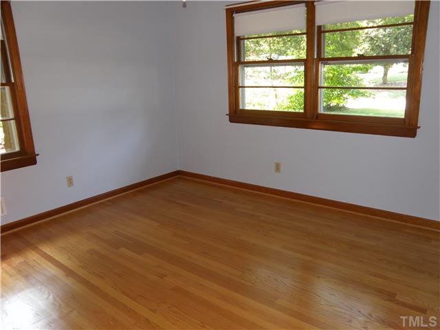 5121 Wickham Road Raleigh, NC 27606 - Photo 13 of 21 an empty room with a window
