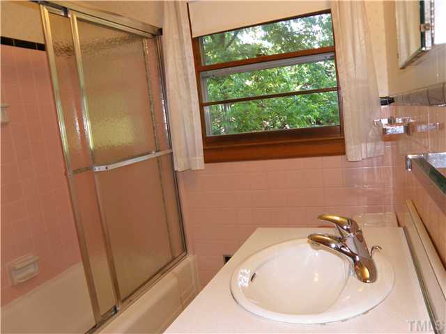 5121 Wickham Road Raleigh, NC 27606 - Photo 14 of 21 a bathroom with a sink and a tub