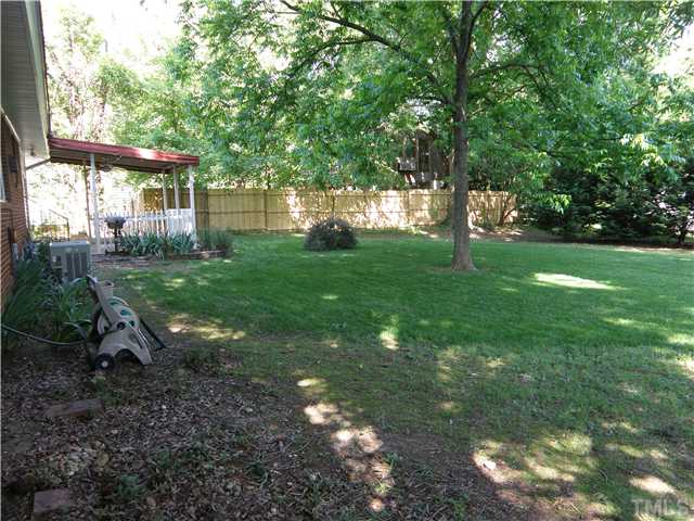 5121 Wickham Road Raleigh, NC 27606 - Photo 18 of 21 a view of a house with backyard