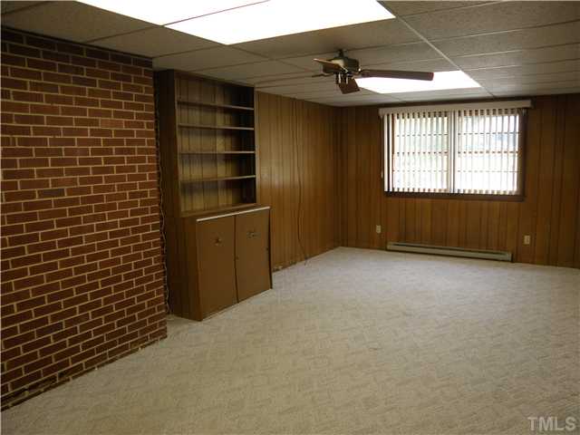 5121 Wickham Road Raleigh, NC 27606 - Photo 4 of 21 a view of an empty room with a window