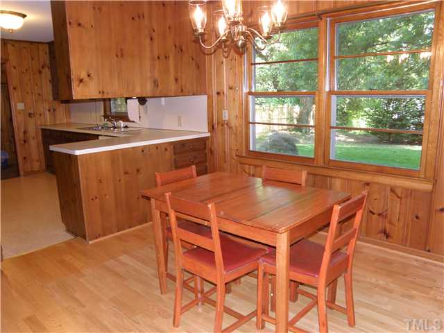 5121 Wickham Road Raleigh, NC 27606 - Photo 9 of 21 a dining room with a sink and a window