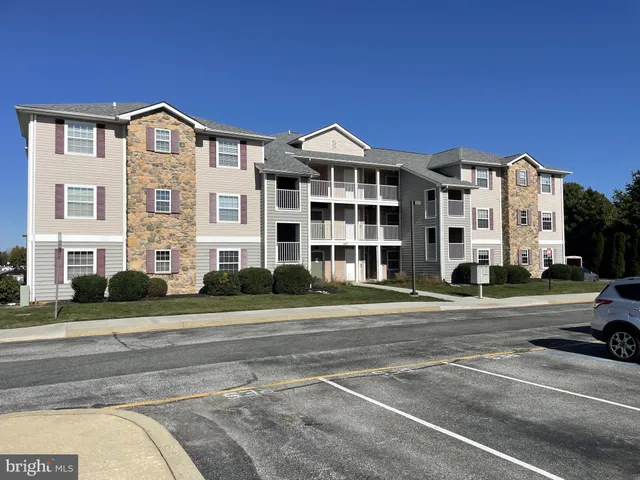 a front view of residential houses with street