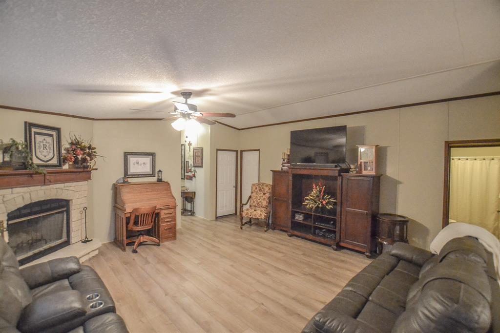 0 County Road 3409 Chandler, TX 75758 - Photo 17 of 38 a living room with furniture and a fireplace