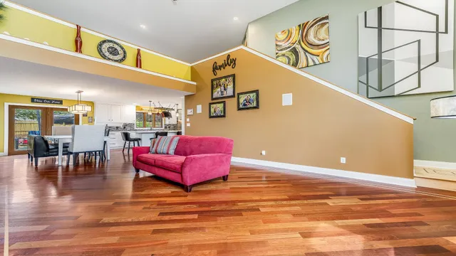 a room with furniture and view of hallway