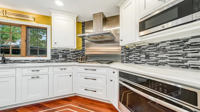 a kitchen with granite countertop a sink and a stove