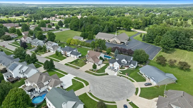 an aerial view of residential houses with outdoor space