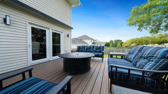 a view of swimming pool with outdoor seating and plants