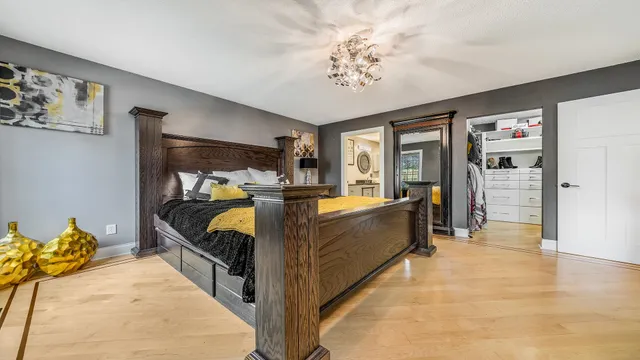 a bed room with furniture and a chandelier