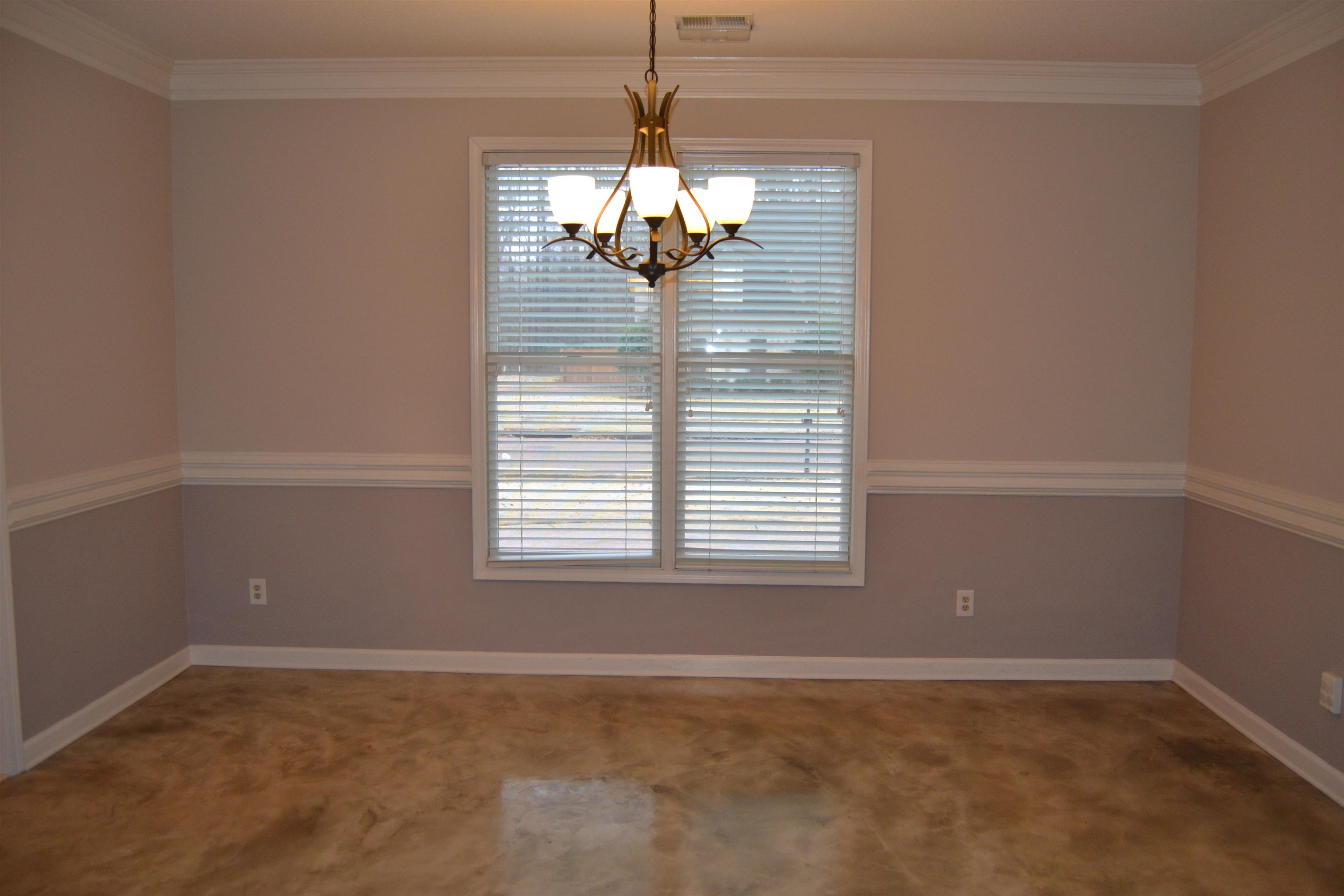 10486 Juneau Way Collierville, TN 38017 - Photo 3 of 33 Carpeted empty room featuring a chandelier and ornamental molding