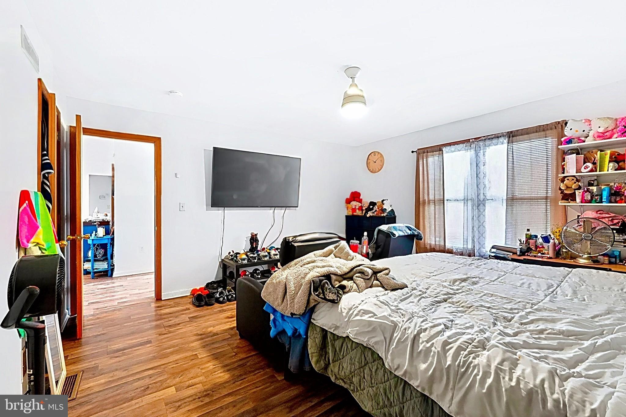 4341 Pine Ridge Drive East Bushkill, PA 18324 - Photo 12 of 19 Cozy bedroom with warm wooden floors.