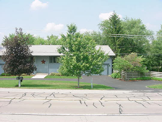 5728 Spring Brook Road Rockford, IL 61114 - Photo 1 of 6 a backyard of a house with lots of green space
