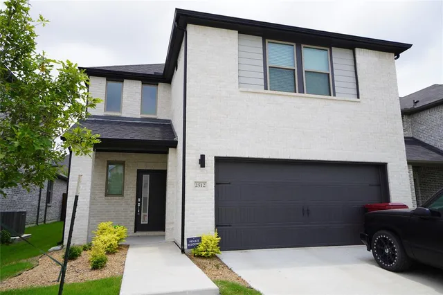 a car parked in front of a house