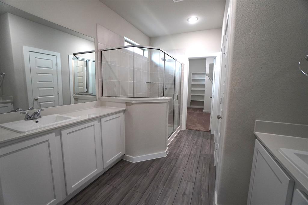 2512 Green River Road Royse City, TX 75189 - Photo 7 of 13 a bathroom with a double vanity sink and mirror