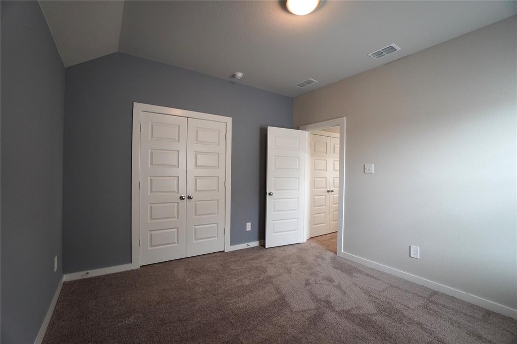 2512 Green River Road Royse City, TX 75189 - Photo 10 of 13 an empty room with closet and bathroom