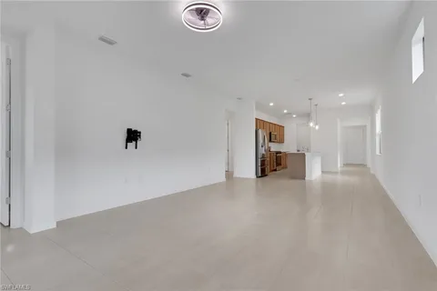 a view of a livingroom with a kitchen