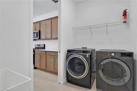 a view of a storage & utility room with washer and dryer