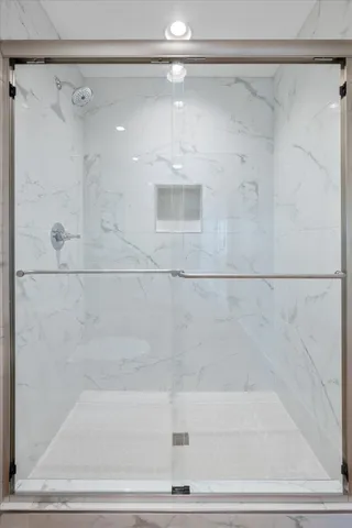 a bathroom with a shower and a shower