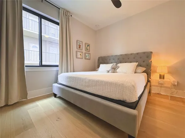 a bedroom with a bed and window