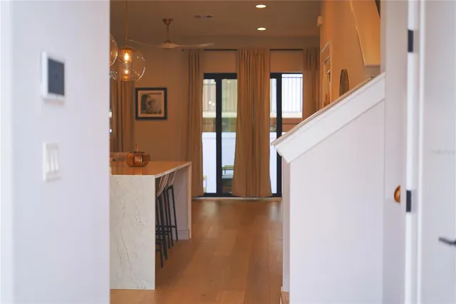 a view of hallway with livingroom and furniture
