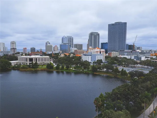 an aerial view of a house with garden space and ocean view