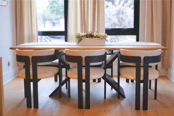 a view of a dining room with furniture and window