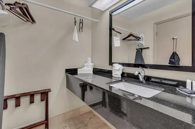 a bathroom with a sink and a mirror