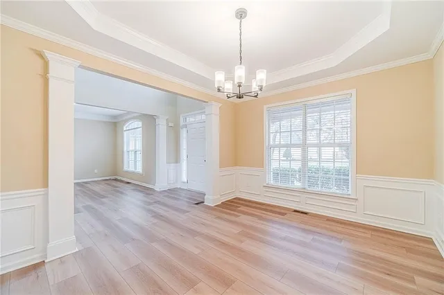 a view of an empty room with a fireplace and a window