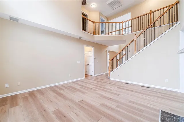 a spacious bathroom with a granite countertop sink mirror and