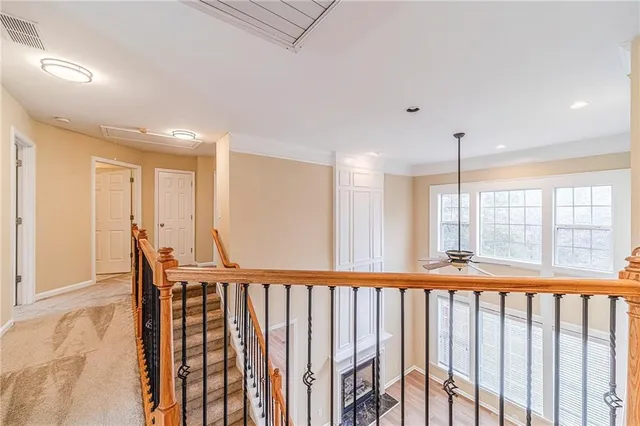 a spacious bathroom with a granite countertop sink mirror and shower