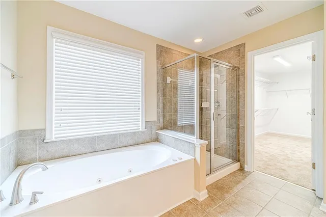 a view of an empty room and wooden floor