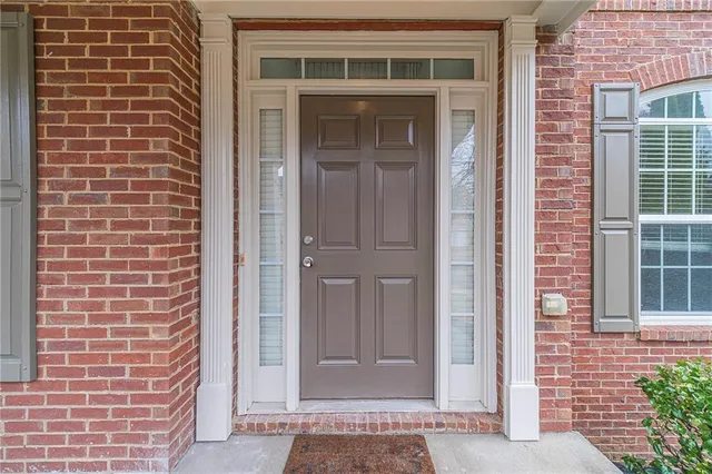 a view of staircase with wooden floor and windows