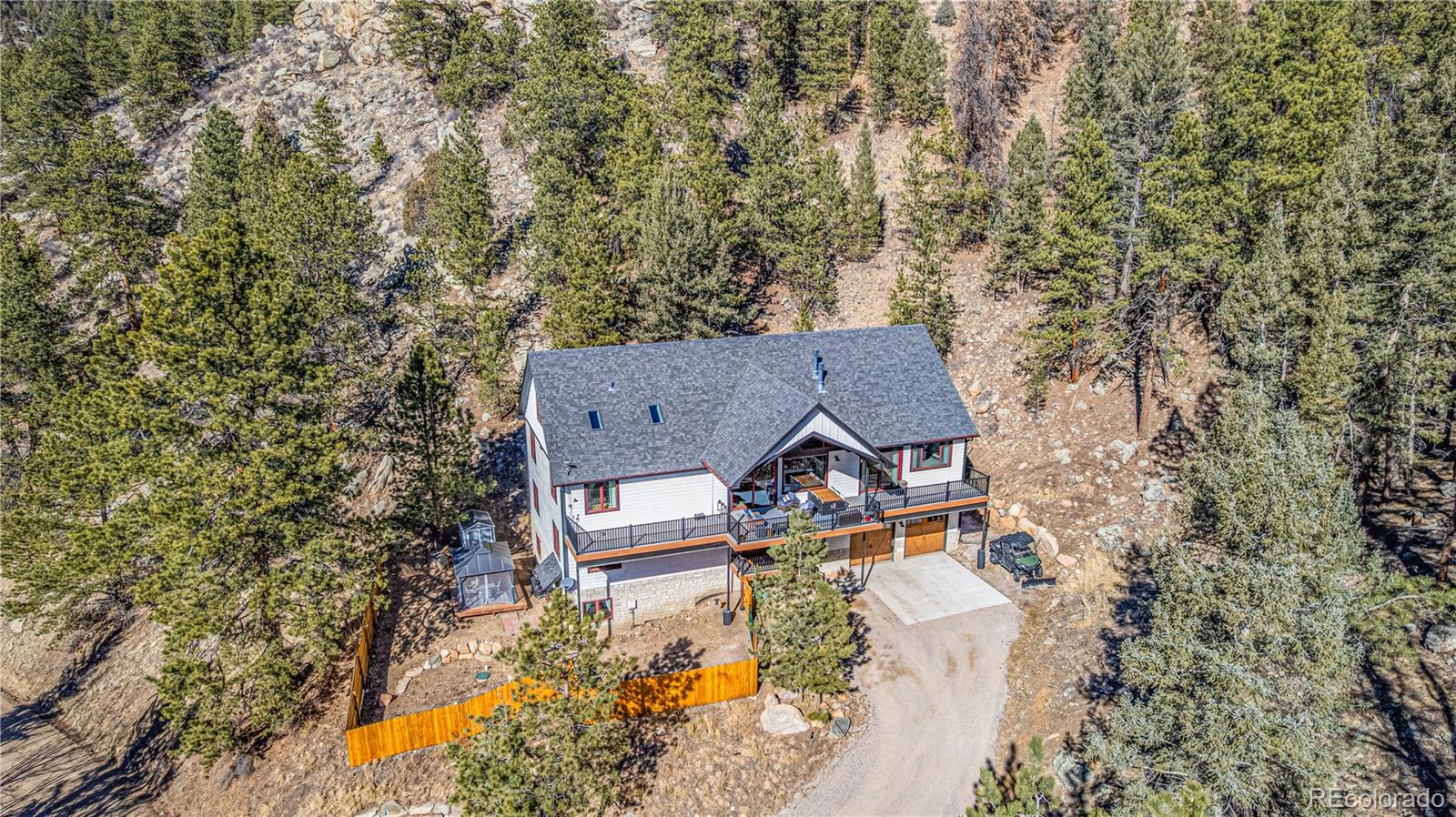663 Brookside Drive Bailey, CO 80421 - Photo 44 of 47 an aerial view of a house with yard and outdoor seating