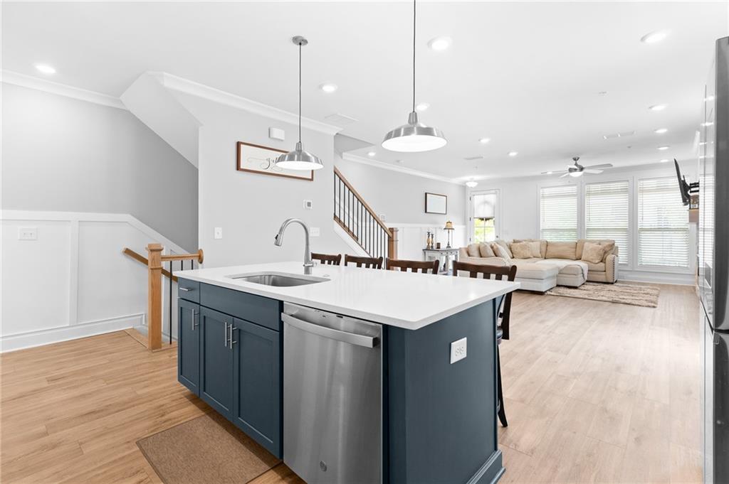 300 Olmstead Way Alpharetta, GA 30022 - Photo 18 of 52 a kitchen with a sink a counter space appliances and cabinets