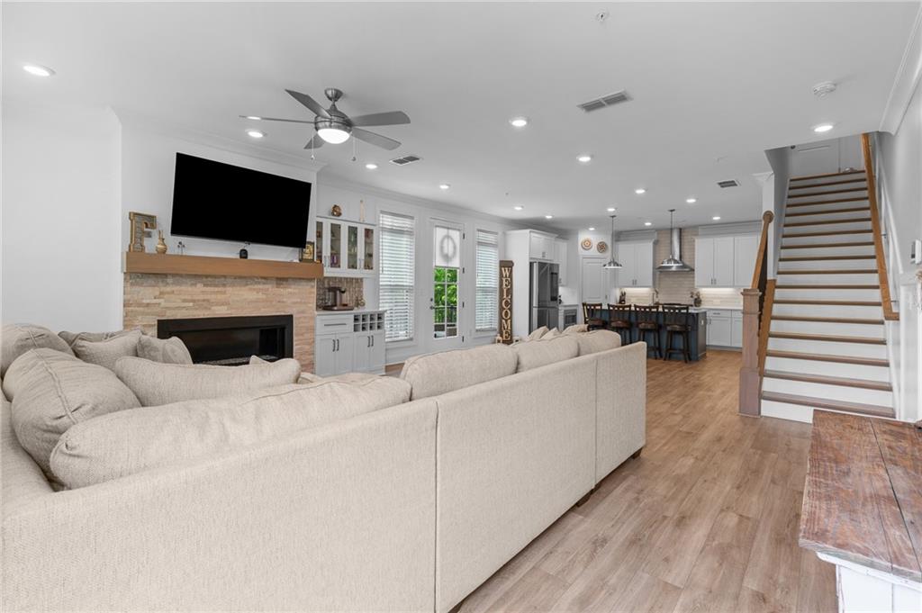 300 Olmstead Way Alpharetta, GA 30022 - Photo 2 of 52 a living room with furniture fireplace and flat screen tv