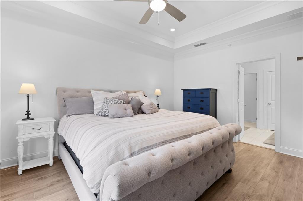 300 Olmstead Way Alpharetta, GA 30022 - Photo 30 of 52 a bedroom with a bed and a ceiling fan