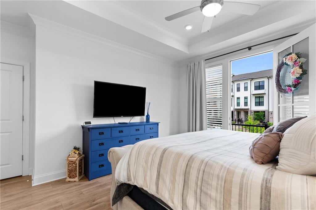 300 Olmstead Way Alpharetta, GA 30022 - Photo 32 of 52 a bedroom with a bed and a flat screen tv