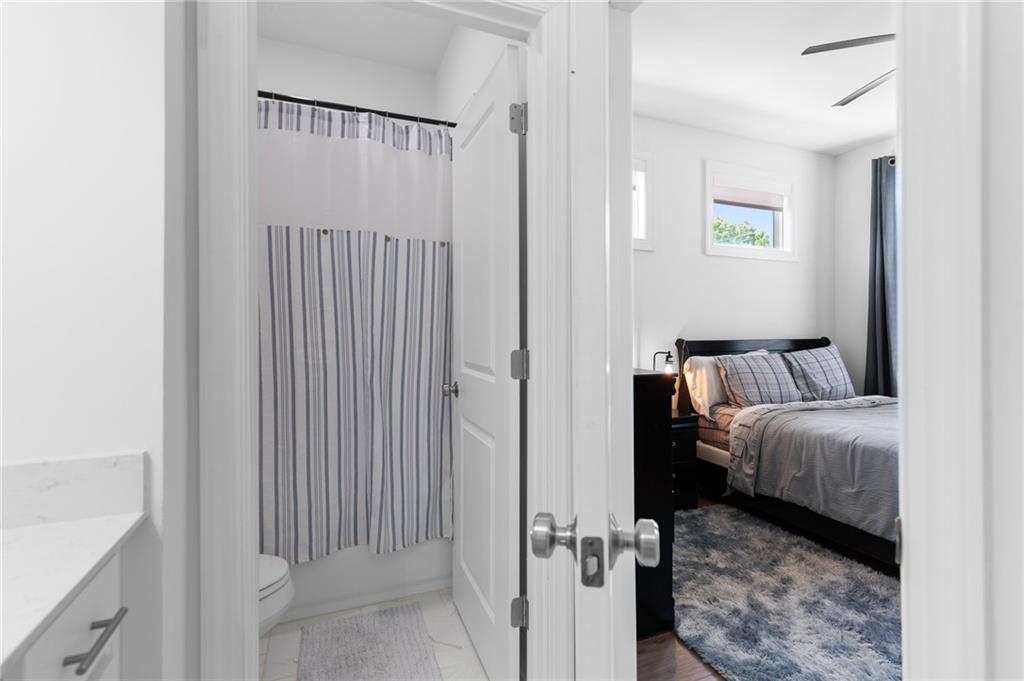 300 Olmstead Way Alpharetta, GA 30022 - Photo 39 of 52 a view of a bedroom with a bed and a window