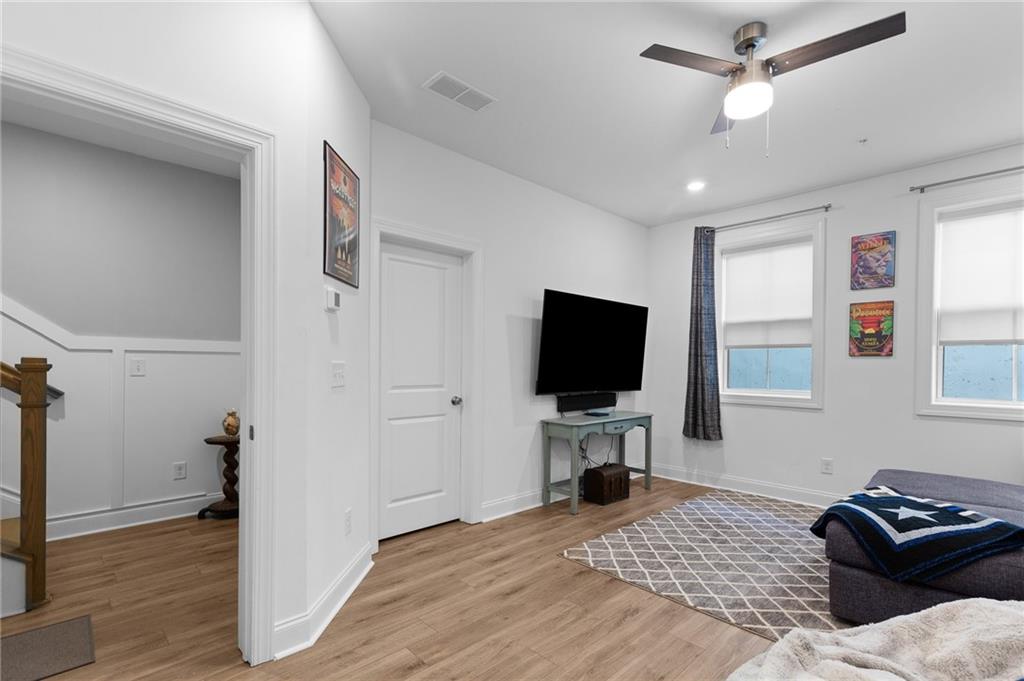 300 Olmstead Way Alpharetta, GA 30022 - Photo 42 of 52 a living room with furniture and a flat screen tv