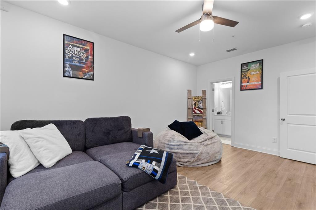 300 Olmstead Way Alpharetta, GA 30022 - Photo 44 of 52 a living room with furniture and a ceiling fan