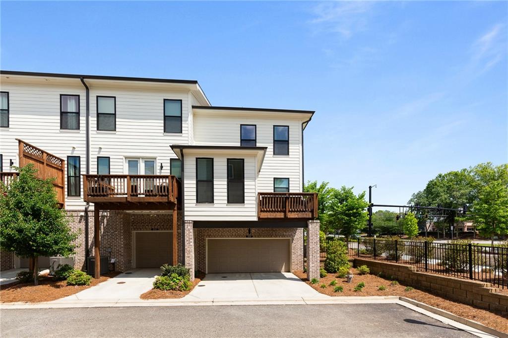 300 Olmstead Way Alpharetta, GA 30022 - Photo 47 of 52 a front view of a house with a yard