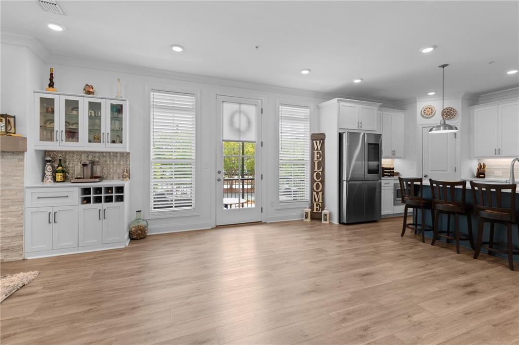300 Olmstead Way Alpharetta, GA 30022 - Photo 8 of 52 a view of kitchen with stainless steel appliances granite countertop a refrigerator and a stove top oven
