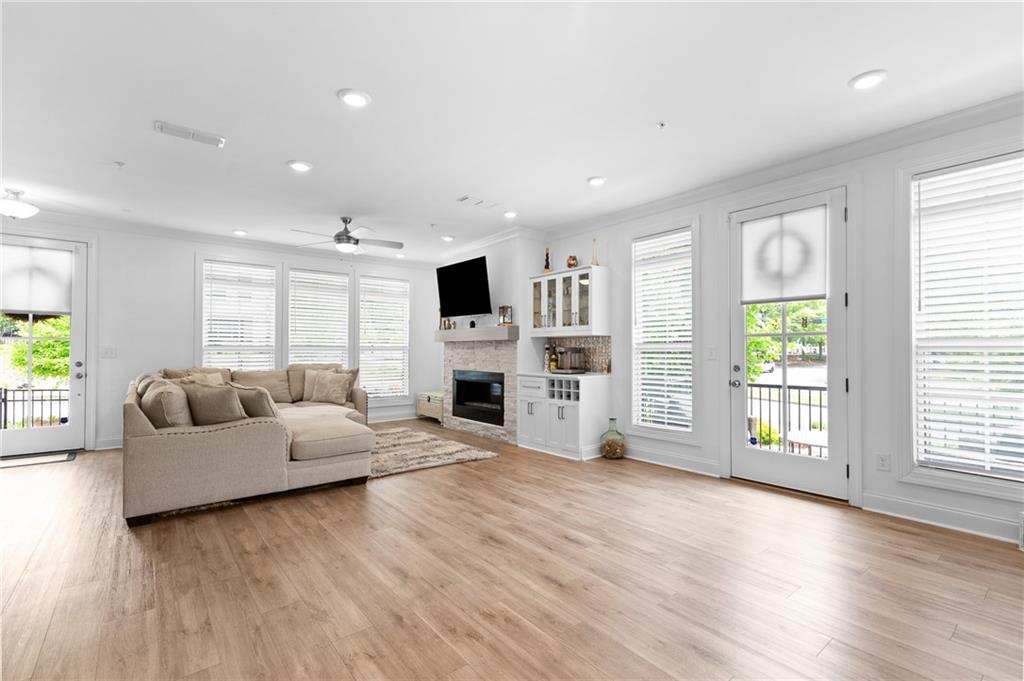 300 Olmstead Way Alpharetta, GA 30022 - Photo 9 of 52 a living room with furniture and a fireplace