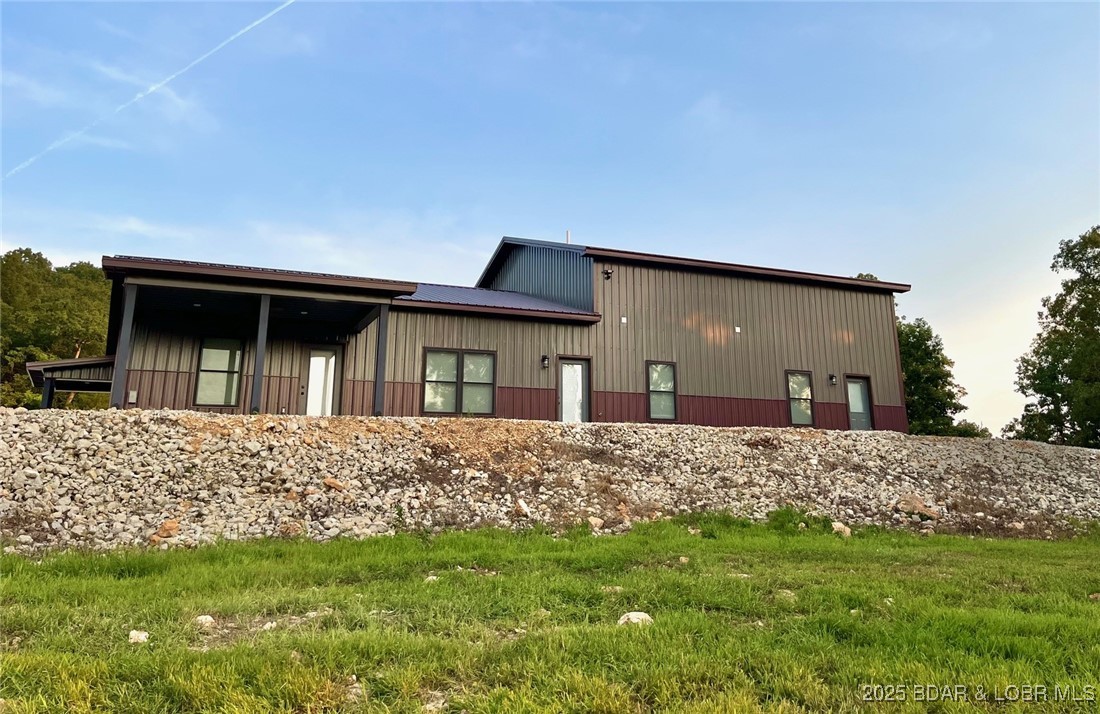 26450 Eagle Point Road, Unit (70' LAKEFRONT) Barnett, MO 65011 - Photo 49 of 52 Behind shouse