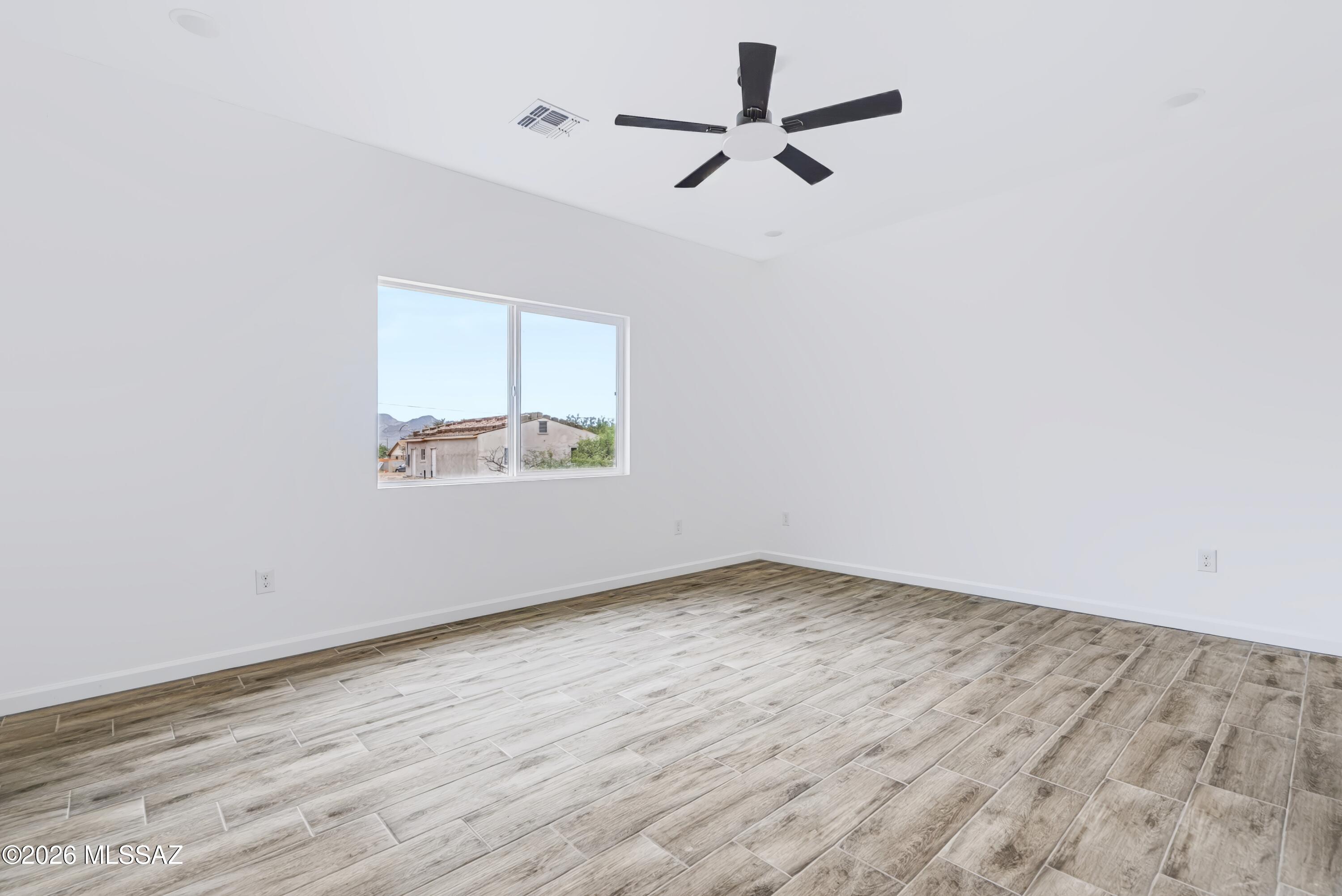 1850 Calle Virginia Rio Rico, AZ 85648 - Photo 17 of 23 Another view of good sized bedroom with plenty of light and ceiling fan